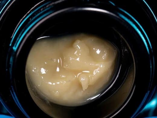 Close-up of Live Hash Rosin concentrate in a dab jar from GreenCart Lab+